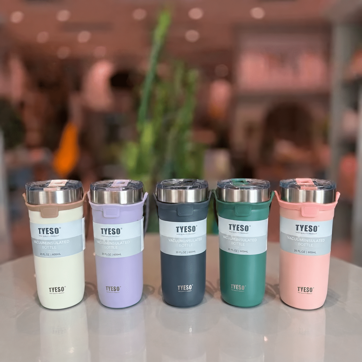 Five colorful TYESO tumblers on tabletop تراول دسته سیلیکونی 710 تیسو - تصویر 1
