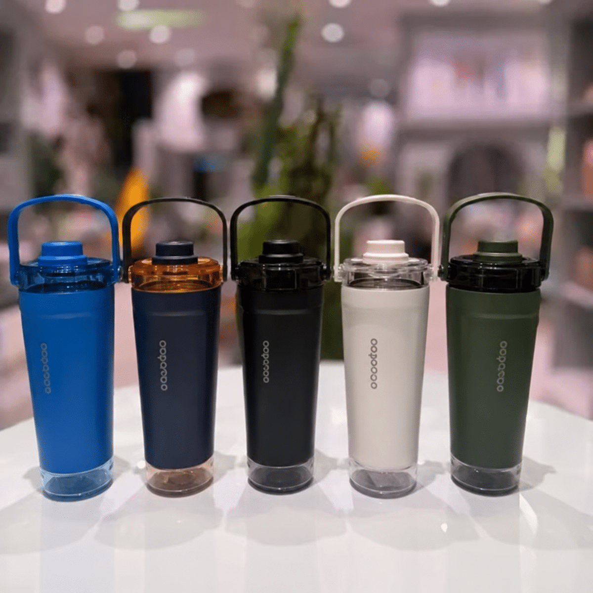 Five shaker bottles on a reflective tabletop (1) شیکر سطلی 650 میل ژيدوا - تصویر 1