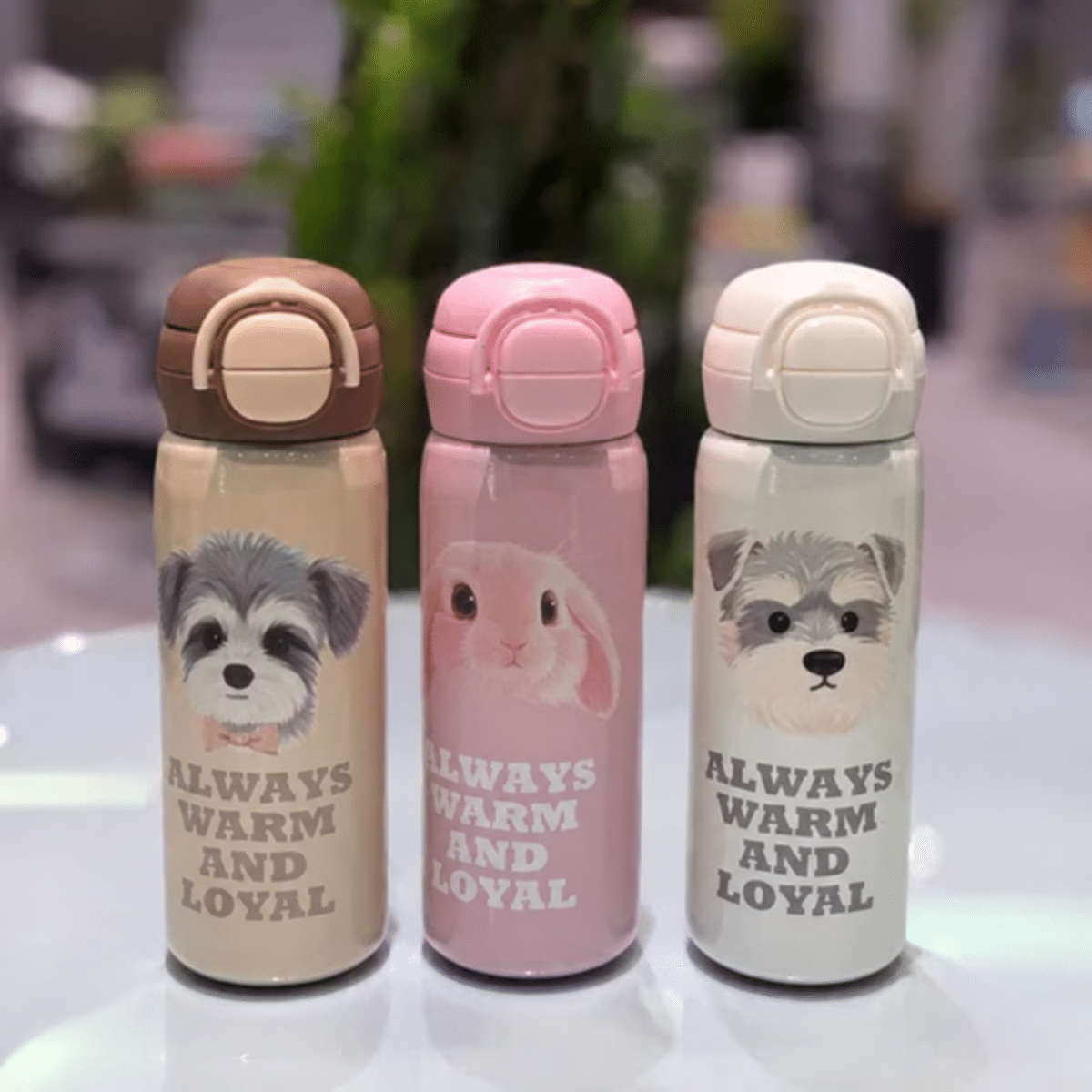 Three adorable dog-design travel bottles تراول دو درب طرح سگ - تصویر 1